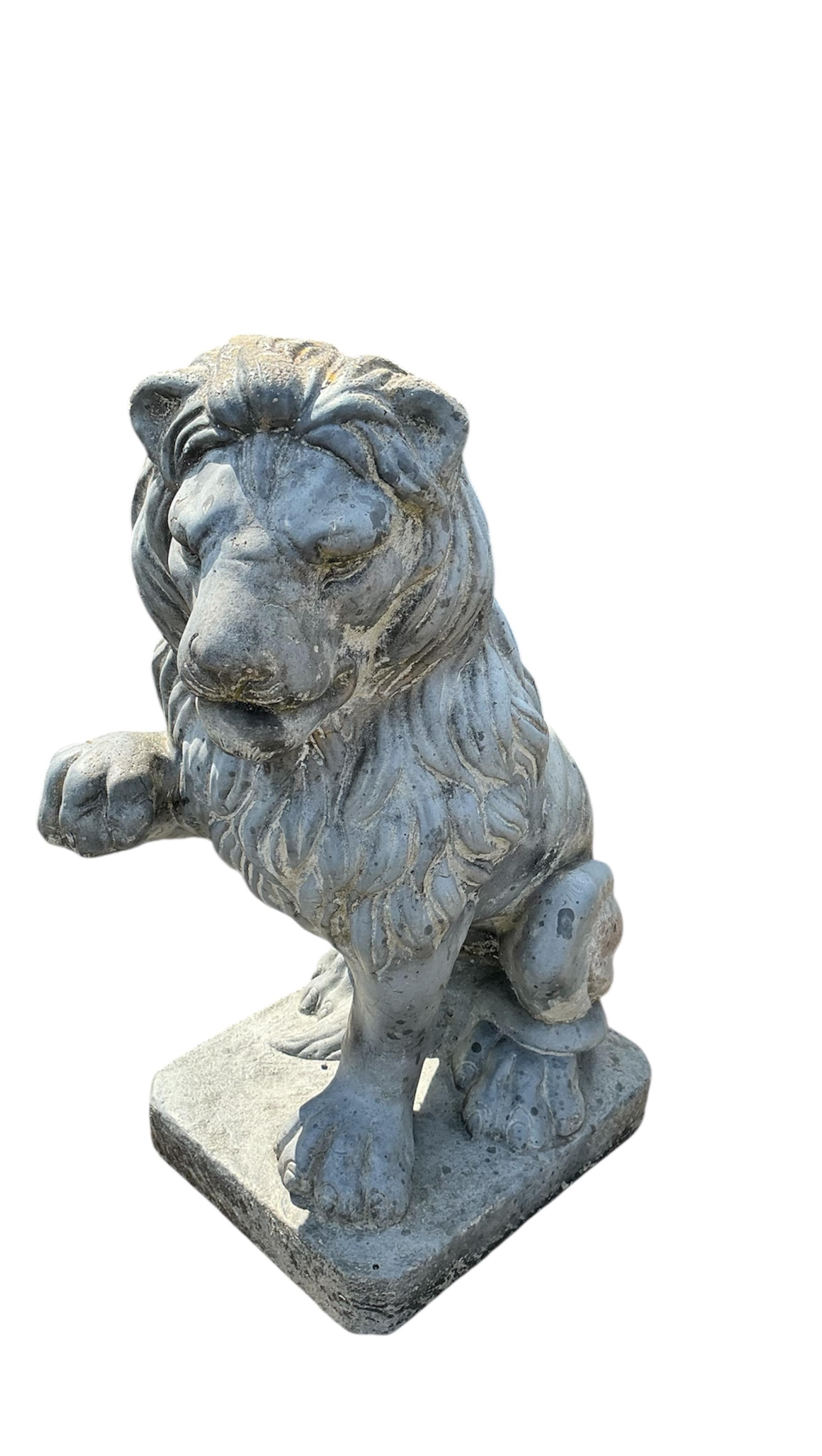 A pair of reconstituted stone, faux lead, lion passant garden ornaments, height 60cm